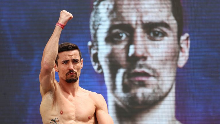Anthony Crolla poses on the scale during his official weigh-in ahead of his unified lightweight title fight against Vasiliy Lomachenko at Los Angeles Convention Center on April 11, 2019 in Los Angeles, California.