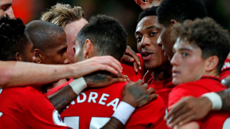 Anthony Martial of Manchester United celebrates with his team-mates after scoring against Norwich City