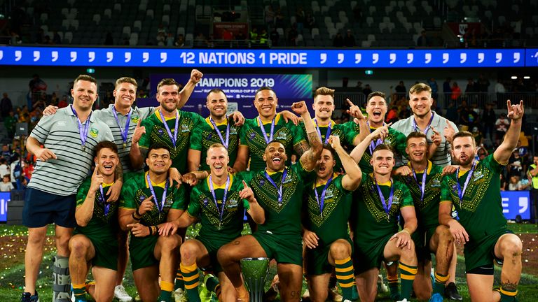 Players of Australia celebrate victory with the trophy during the Final Rugby League World Cup 9s 