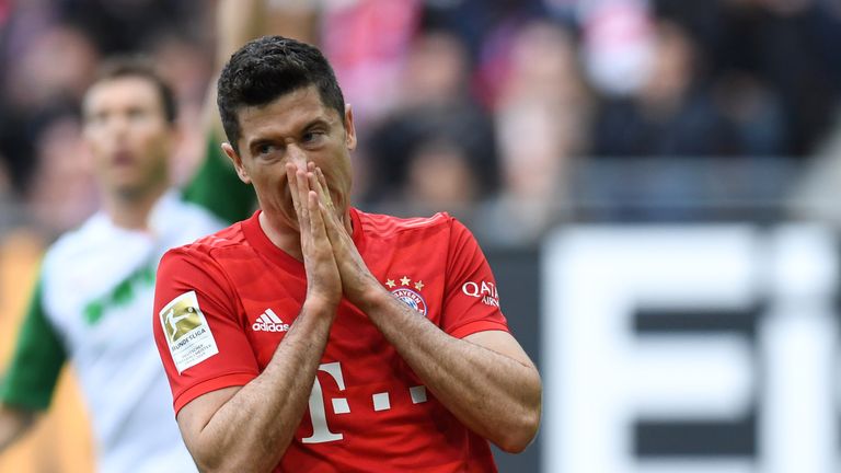 Bayern Munich striker Robert Lewandowski reacts after missing a good chance