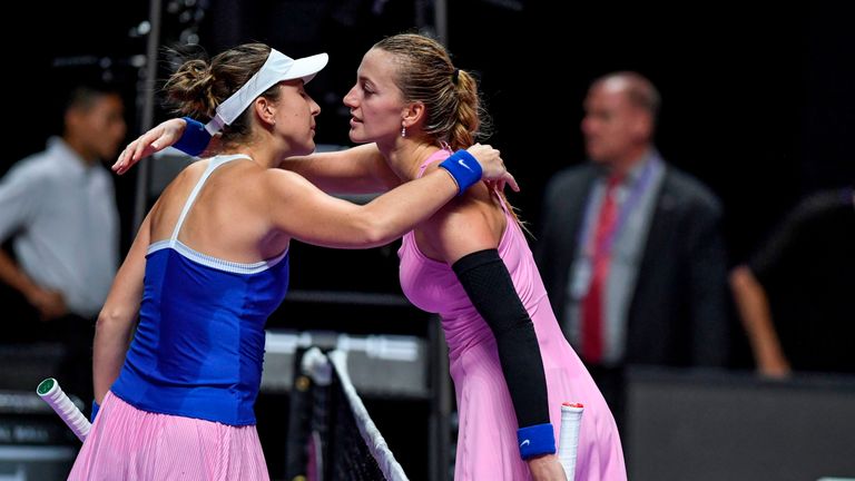 Belinda Bencic of Switzerland (L) greets Petra Kvitova of Czech Republic after winning on their women's singles match in the WTA Finals tennis tournament in Shenzhen on October 29, 2019. 