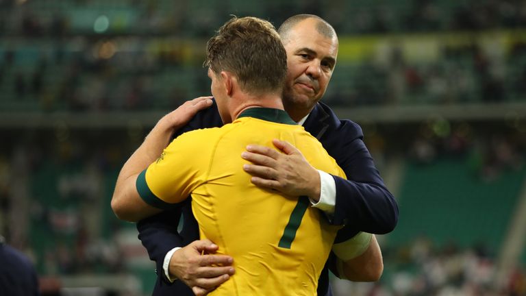 Michael Cheika consoles his players after the England defeat