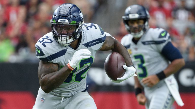 Running back Chris Carson has taken some of the pressure off Wilson this season