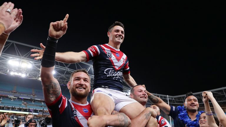 SYDNEY, AUSTRALIA - OCTOBER 06: Cooper Cronk of the Roosters (C) is chaired off the field by Jared Waerea-Hargreaves (L) and Boyd Cordner (R) during the 2019 NRL Grand Final match between the Canberra Raiders and the Sydney Roosters at ANZ Stadium on October 06, 2019 in Sydney, Australia. (Photo by Matt King/Getty Images)