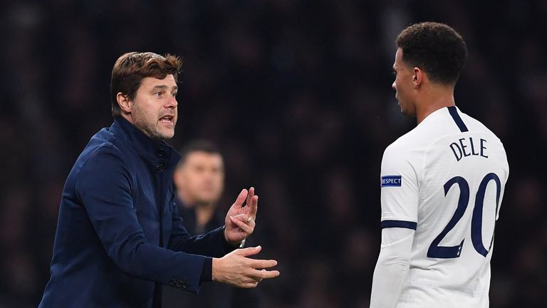 Tottenham manager Mauricio Pochettino talks to Dele Alli during the game against Red Star Belgrade