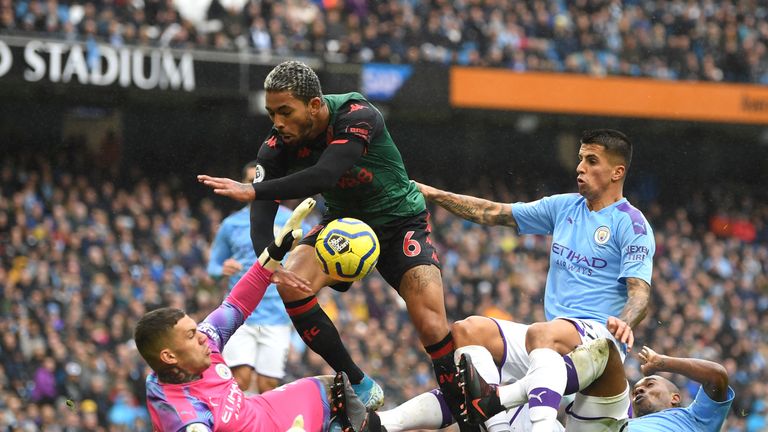 Douglas Luiz in action against Manchester City
