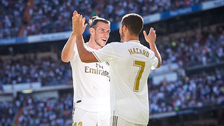 Eden Hazard celebrates with Gareth Bale after scoring for Real Madrid against Granada