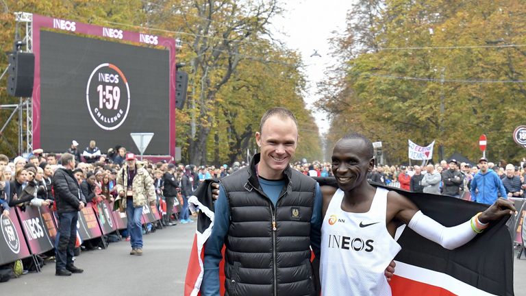 Kenya's Eliud Kipchoge (R) and British cyclist and Tour de France winner Chris Froome pose in the finish area after the "Ineos 1:59 Challenge: Sub-Two Marathon Attempt" after Kipchoge busted the mythical two-hour barrier for the marathon on October 12 2019 in Vienna. - With a timing of 1hr 59min 40.2sec, the Olympic champion became the first ever to run a marathon in under two hours. (Photo by HERBERT NEUBAUER / APA / AFP) / RESTRICTED TO EDITORIAL USE (Photo by HERBERT NEUBAUER/APA/AFP via Gett