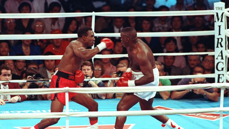 Evander Holyfield (L) won the heavyweight title after being cruiserweight champion