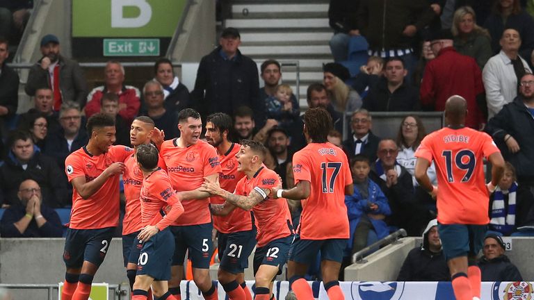 Everton players celebrate their equaliser at Brighton