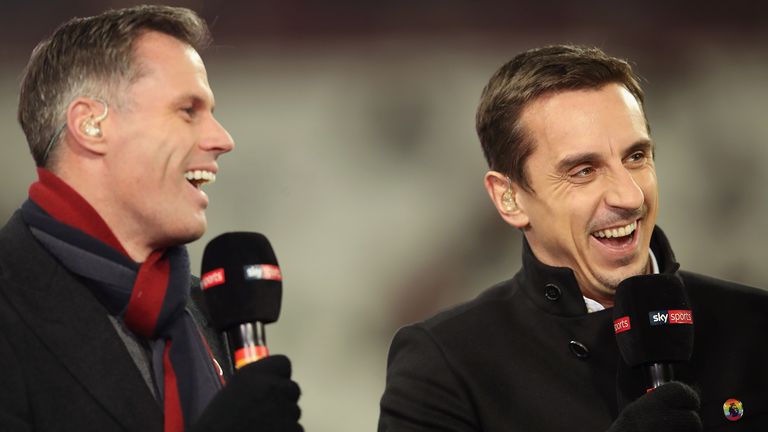 Pundits Jamie Carragher (L) and Gary Neville laugh prior to the Premier League match between West Ham United and Leicester City at London Stadium on November 24, 2017 in London, England.