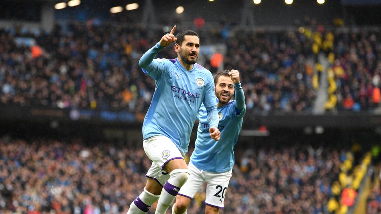 Ilkay Gundogan celebrates scoring Manchester City's third goal against Aston Villa