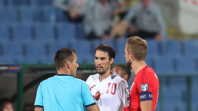 Team captains Ivelin Popov of Bulgaria and England's Harry Kane speak with referee Ivan Bebek during the UEFA Euro 2020 qualifier in Sofia