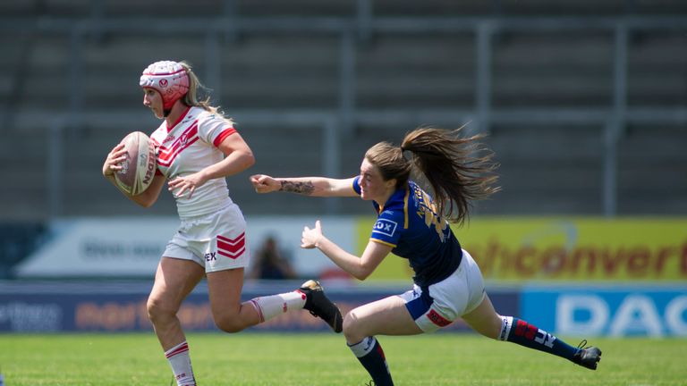 Picture by Isabel Pearce/SWpix.com - 07/07/2019 - Rugby League - Coral Women's Challenge Cup Semi Final - St Helens v Leeds Rhinos - The Totally Wicked Stadium, Langtree Park, St Helens, England - Jodie Cunningham of St Helens is tackled by Sophie Nutall of Leeds.