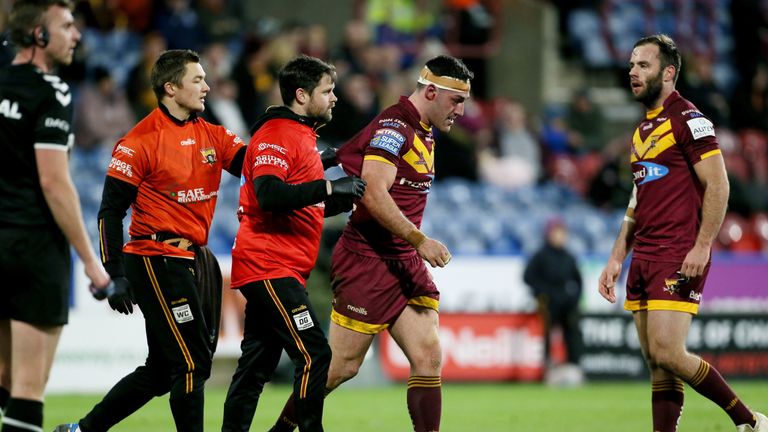 Huddersfield Giants' Joe Wardle goes off with an injury