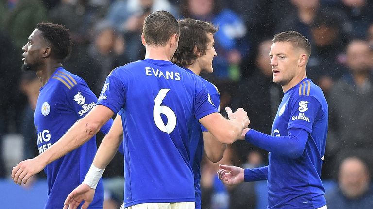 Leicester players Jonny Evans, Caglar Soyuncu and Jamie Vardy