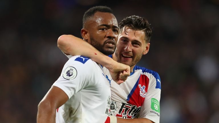 Jordan Ayew of Crystal Palace celebrates with his team mates after scoring his sides second goal which is awarded following a VAR review during the Premier League match between West Ham United and Crystal Palace at London Stadium 