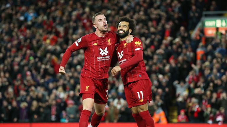 Goalscorers Jordan Henderson and Mohamed Salah celebrate Liverpool's second goal of the game