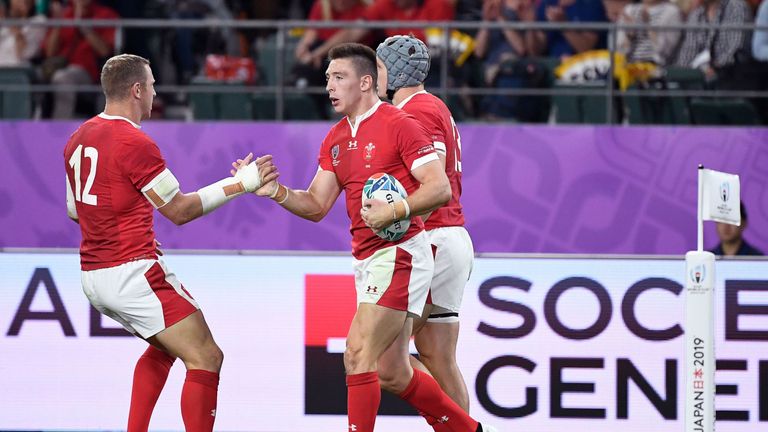 Joshua Adams celebrates after scoring a try against Fiji