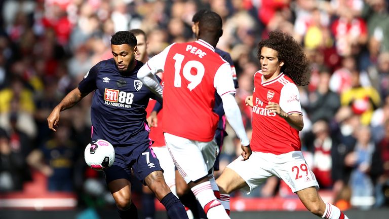 Joshua King battles for possession with Nicolas Pepe and Matteo Guendouzi 