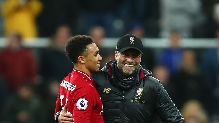 Trent Alexander-Arnold of Liverpool and Jurgen Klopp manager / head coach of Liverpool celebrate at full time during the Premier League match between Newcastle United and Liverpool FC at St. James Park on May 4, 2019 in Newcastle upon Tyne, United Kingdom. 