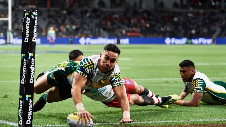 SYDNEY, AUSTRALIA - OCTOBER 18: Kayal Iro of Cook Islands scores a try during the round 1 Rugby League World Cup 9s match between Tonga and Cook Islands at Bankwest Stadium on October 18, 2019 in Sydney, Australia. (Photo by Brett Hemmings/Getty Images)