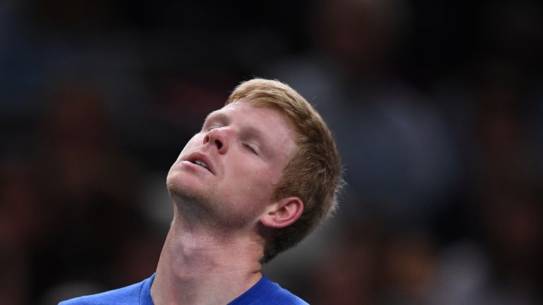 Britain's Kyle Edmund reacts during his tennis match against Serbia's Novak Djokovic during their men's singles tennis match on day four of the ATP World Tour Masters 1000 - Rolex Paris Masters - indoor tennis tournament at The AccorHotels Arena in Paris on October 31, 2019