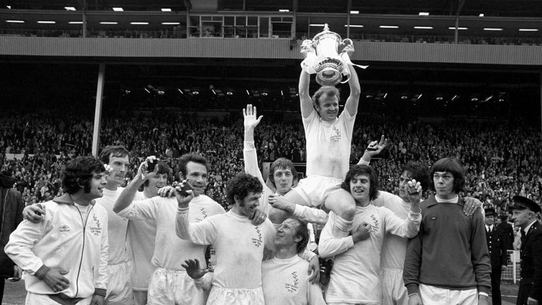 Victorious Leeds United after their FA cup 1-0 win.  Their captain Billy Bremner is holding the trophy aloft.  Left of him is Allan Clarke who scored the only goal to give his team their victory against Arsenal.