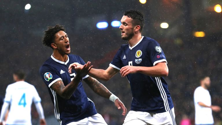 GLASGOW, SCOTLAND - OCTOBER 13: John McGinn celebrates with Liam Palmer after he scores the opening goal during the UEFA Euro 2020 qualifier between Scotland and San Marino at Hampden Park on October 13, 2019 in Glasgow, Scotland. (Photo by Ian MacNicol/Getty Images)