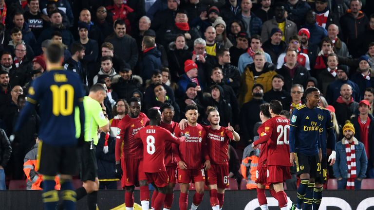 Liverpool players celebrate after Shkodran Mustafi's own-goal gives them a 1-0 lead