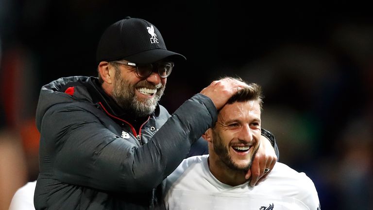 Liverpool manager Jurgen Klopp (left) celebrates with Adam Lallana