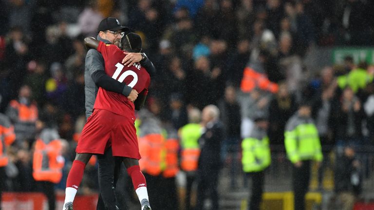 Jurgen Klopp hugs Sadio Mane after the crucial victory