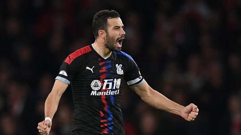 Luka Milivojevic celebrates after converting his penalty at the Emirates