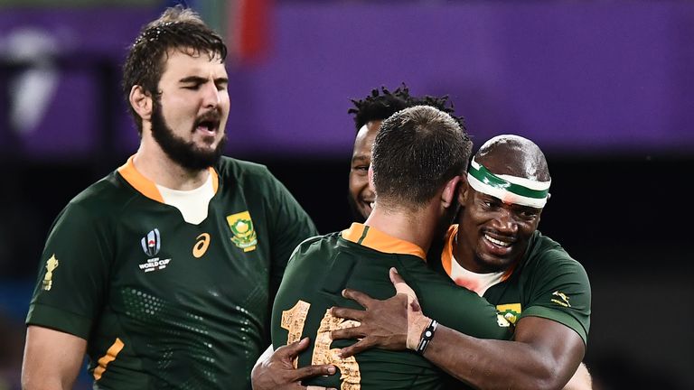 Makazole Mapimpi and Willie Le Roux celebrate after the win over Italy