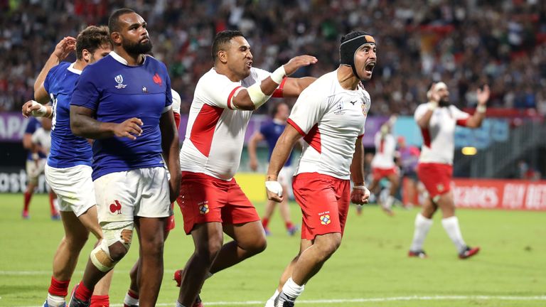 Malietoa Hingano of Tonga celebrates after scoring his team's second try
