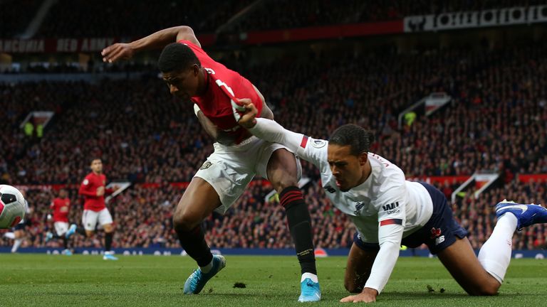 Marcus Rashford and Virgil van Dijk tussle at Old Trafford