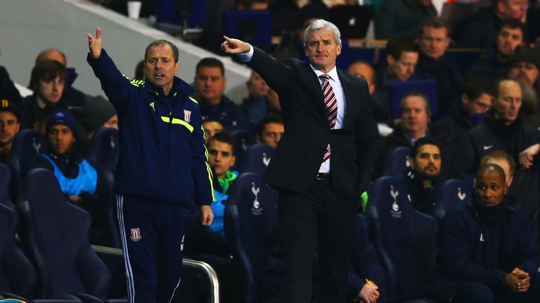 Mark Bowen and Mark Hughes during the Barclays Premier League match between Tottenham Hotspur and Stoke City at White Hart Lane on December 29, 2013 in London, England.