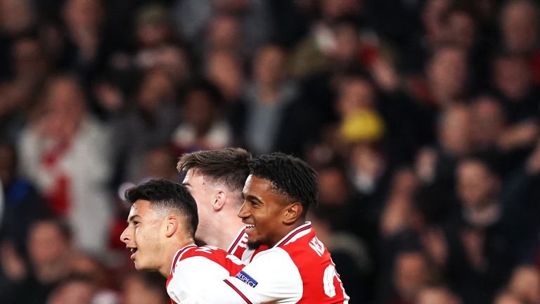 Gabriel Martinelli is embraced by Reiss Nelson