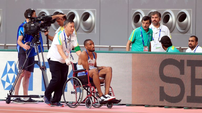 Great Britain's Matthew Hudson-Smith leaves the track in a wheelchair after failing to finish his men's 400m heat at the World Athletics Championships in Doha