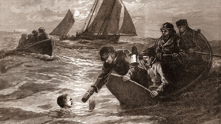 Captain Matthew Webb (1848-1883) of Great Britain, the first person to swim the English Channel without flotation aids, is handed a container of hot coffee during an unsuccessful crossing attempt from Dover, England, 1875. Illustration is a wood engraving published 1875.