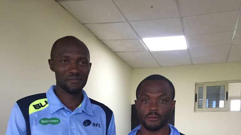 Cameroonian match officials with donated shirts