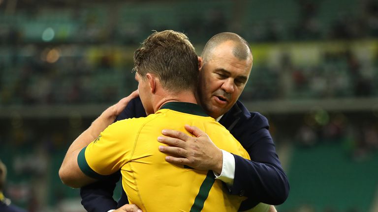 Michael Cheika, Head Coach of Australia and Michael Hooper embrace after their loss to England 