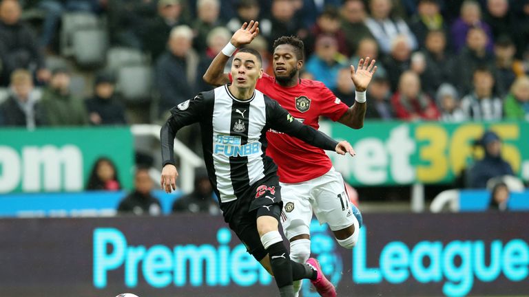 Miguel Almiron and Fred in Premier League action at St. James' Park