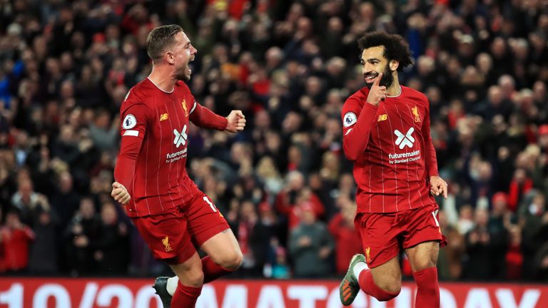Mohamed Salah celebrates with Jordan Henderson after giving Liverpool a 2-1 lead