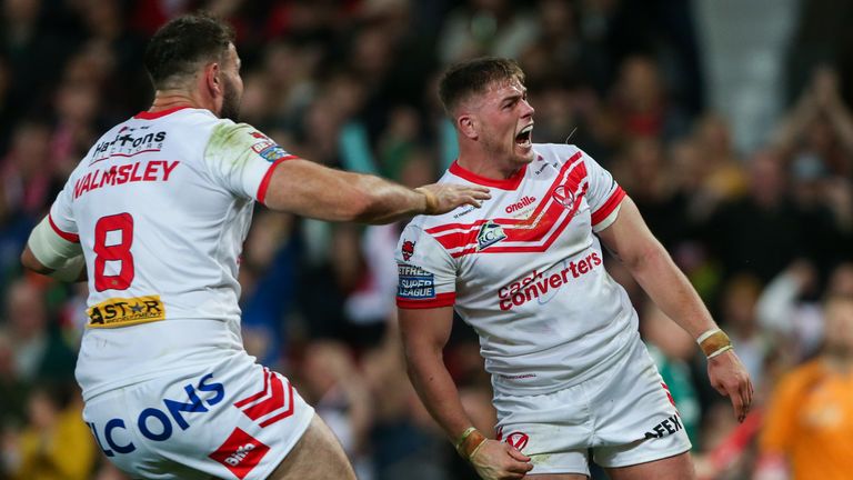 St Helens' Morgan Knowles celebrates his try with Alex Walmsley