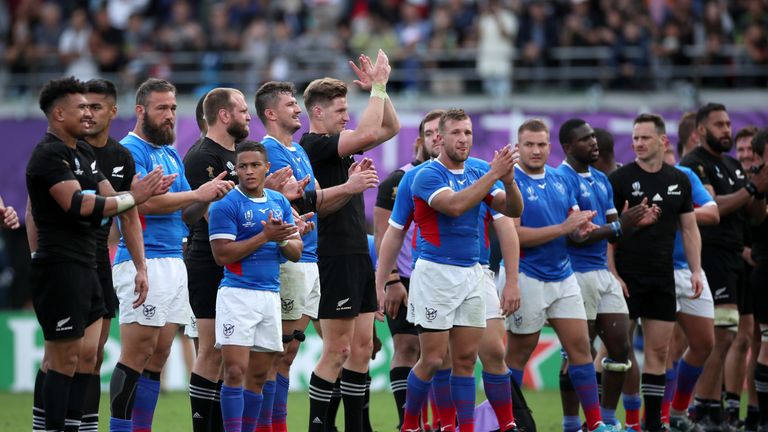 Players applaud fans after the Rugby World Cup 2019 Group B game between New Zealand and Namibia at Tokyo Stadium on October 06, 2019 in Chofu, Tokyo, Japan