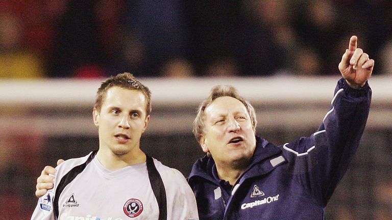 Neil Warnock celebrates with Phil Jagielka after the win
