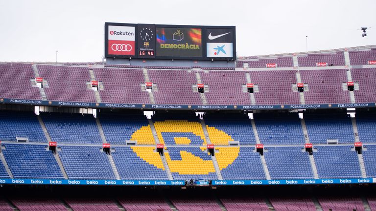 The Nou Camp scoreboard carried a picture of a ballot box and the word 'democracy' during a match behind closed doors
