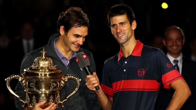 Novak Djokovic of Serbia interviews Roger Federer of Switzerland after his win in the final during Day Seven of the Davidoff Swiss Indoors Tennis at St Jakobshalle on November 7, 2010 in Basel, Switzerland.