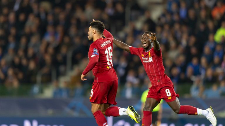 Oxlade-Chamberlain wheels away in delight and is congratulated by Naby Keita